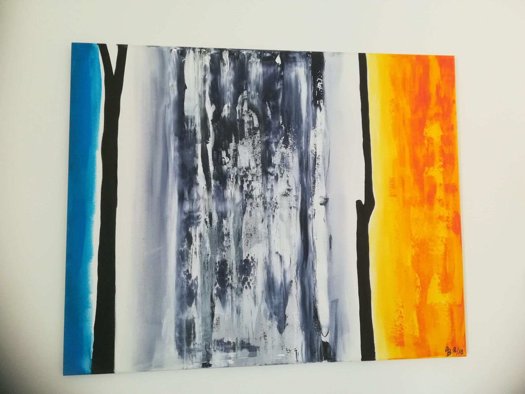 Abstract vertical stripes: blue on the left, gray-black in the middle, yellow on the right.