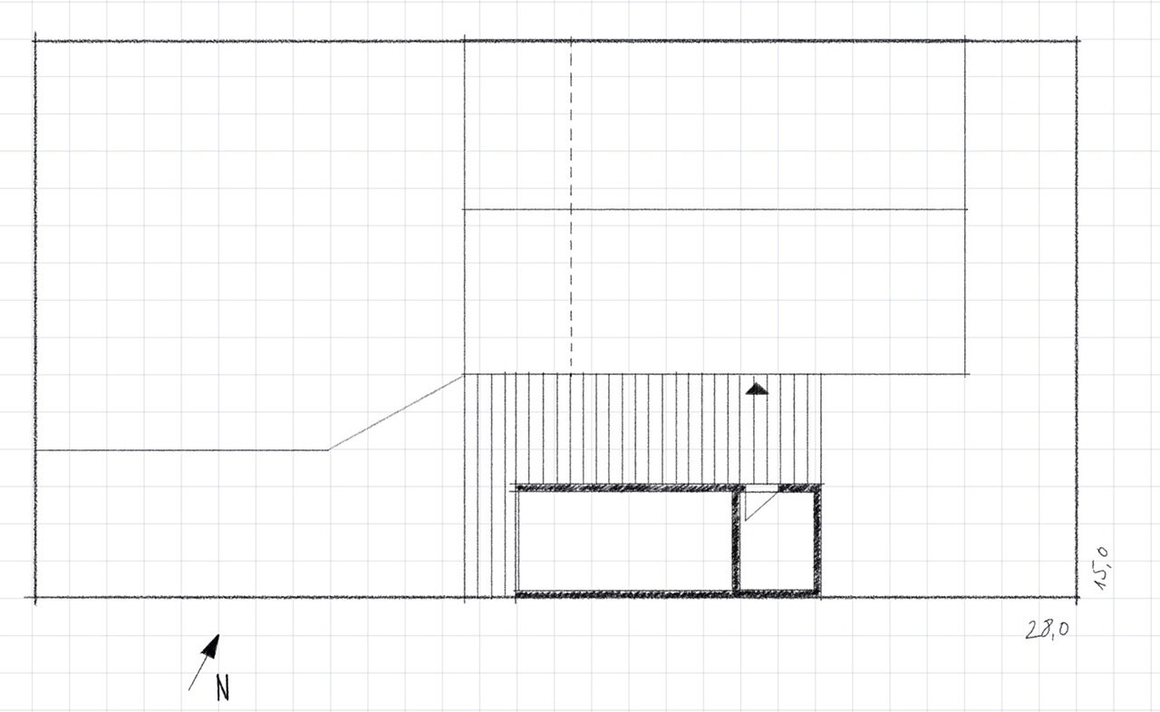 Architectural floor plan on graph paper with dimension lines, north arrow, and interior spaces.