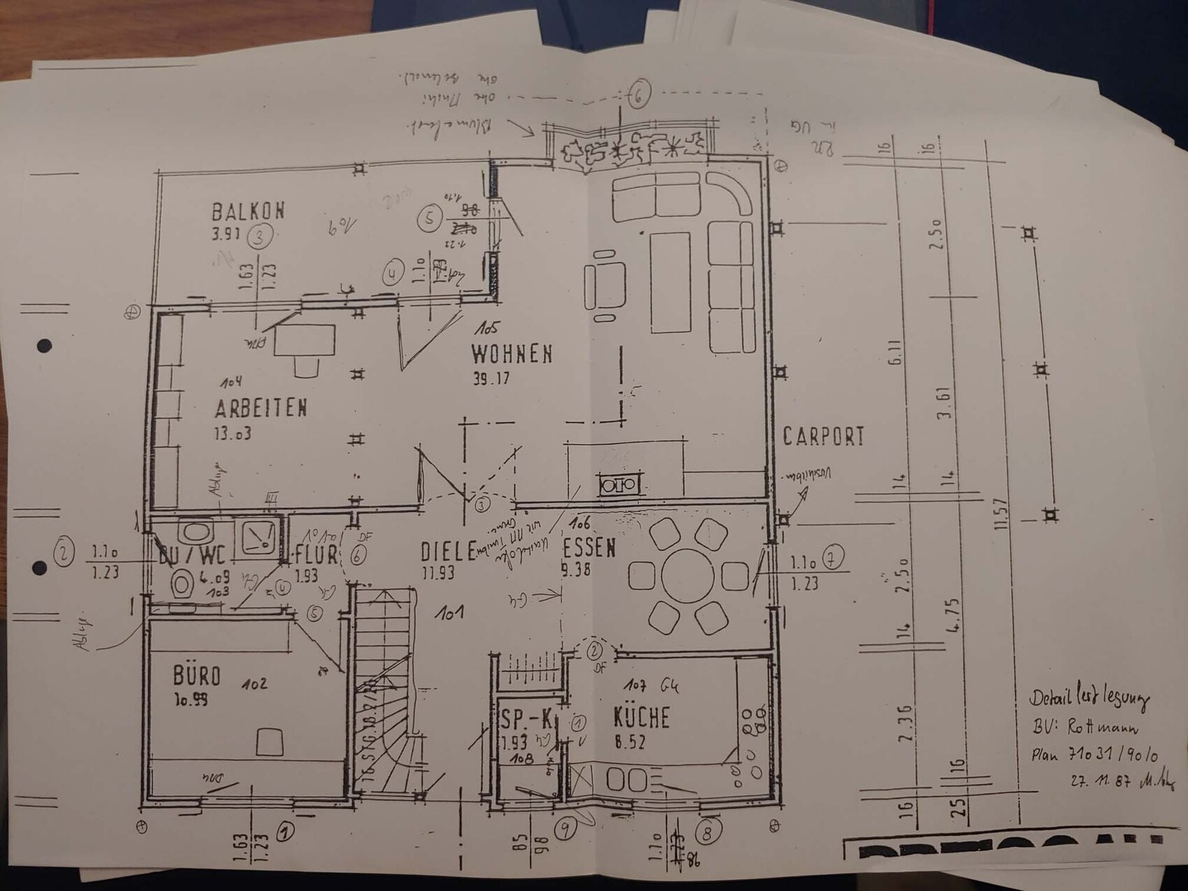 Floor plan of a residential house: living room, workspace, kitchen, dining area, balcony, and carport.