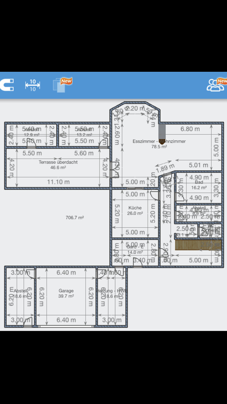 Floor plan of a house with several rooms, terrace, kitchen, bathroom, and garage.