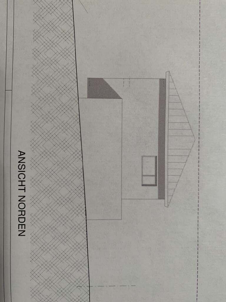 North elevation of a house with gable roof, small window, and entrance door.