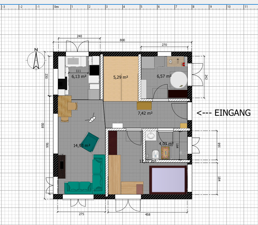 Floor plan of an apartment: Entrance on the right, living room with teal sofa, kitchen, hallway, bedroom.