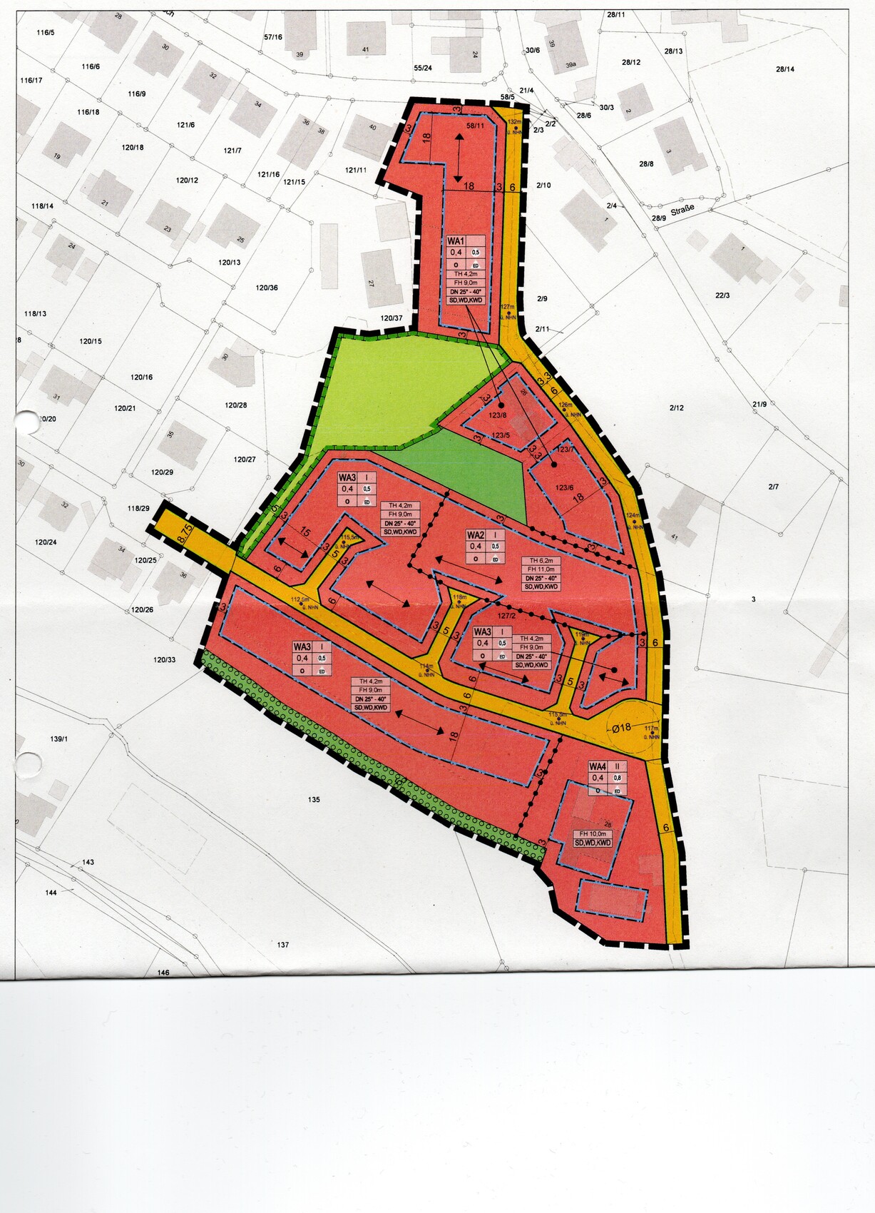 Site plan of a development area: red building zones, green areas, yellow streets, black outline.