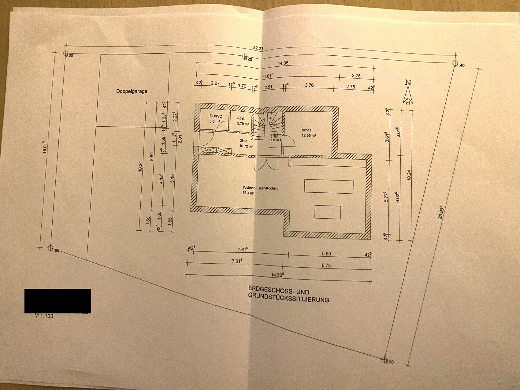 Ground floor plan: double garage on the left, open living and kitchen area, hallway, study.
