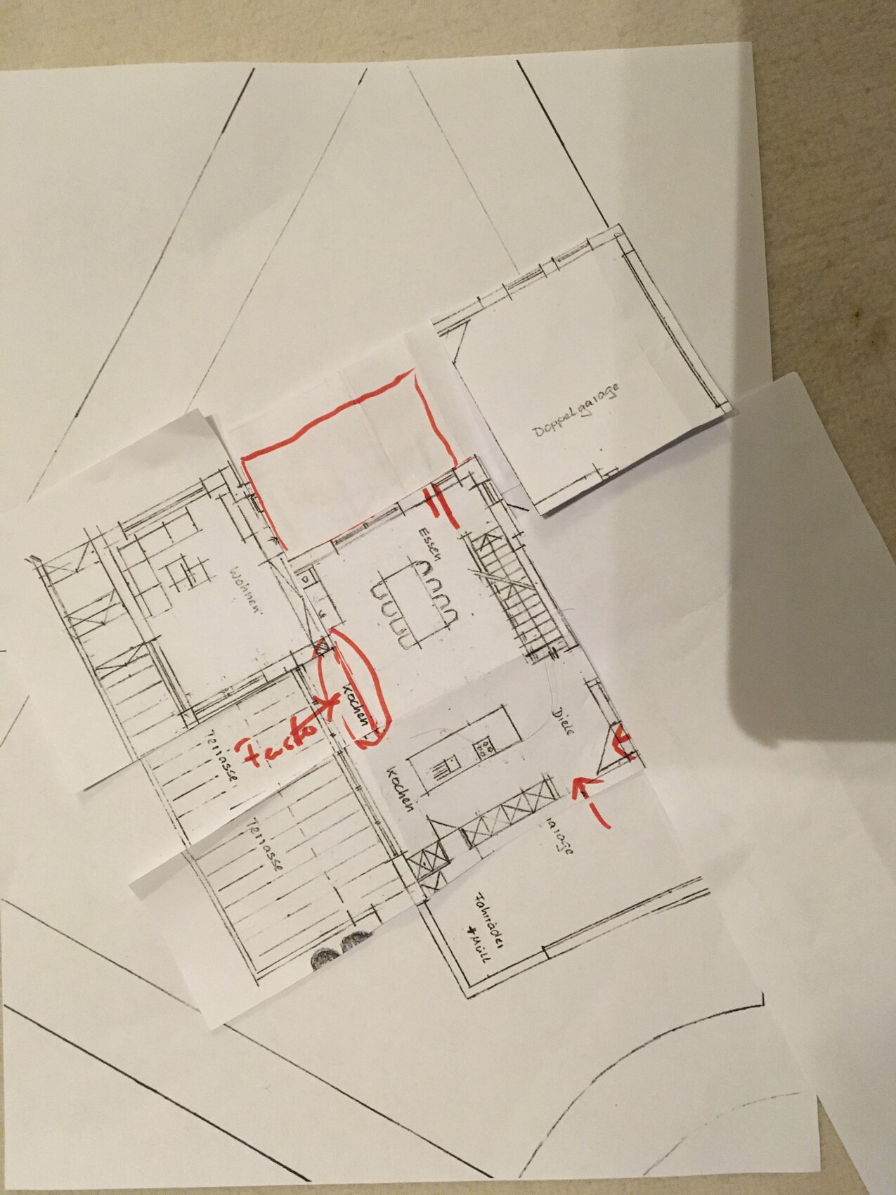 Architectural floor plan of a house with kitchen, stairs, and red markings.