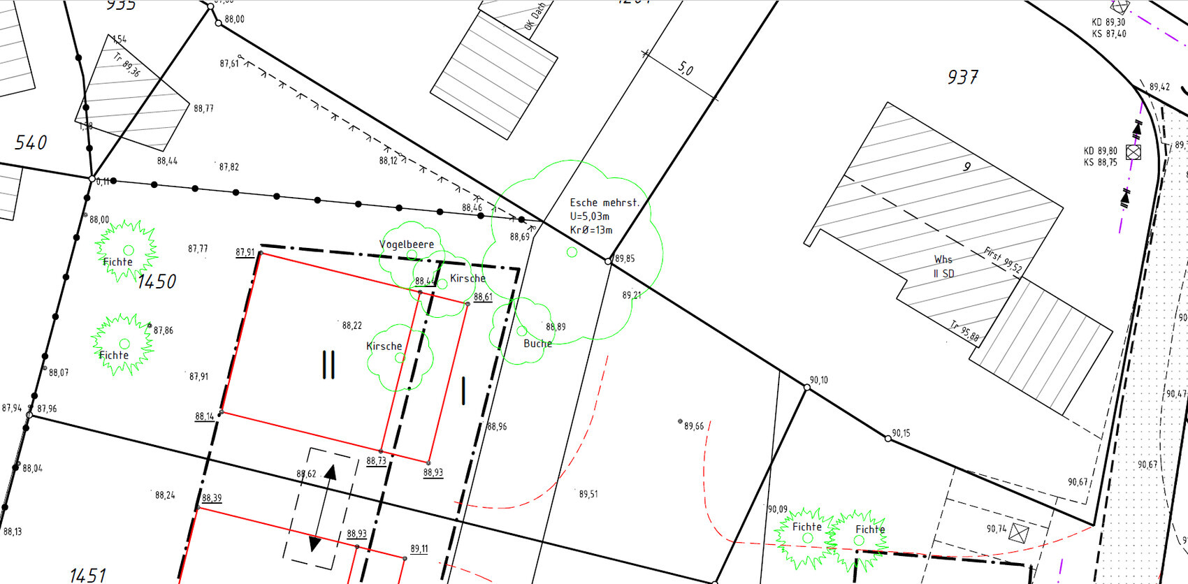 Site plan of a building plot with boundary lines, buildings, trees, and driveways.