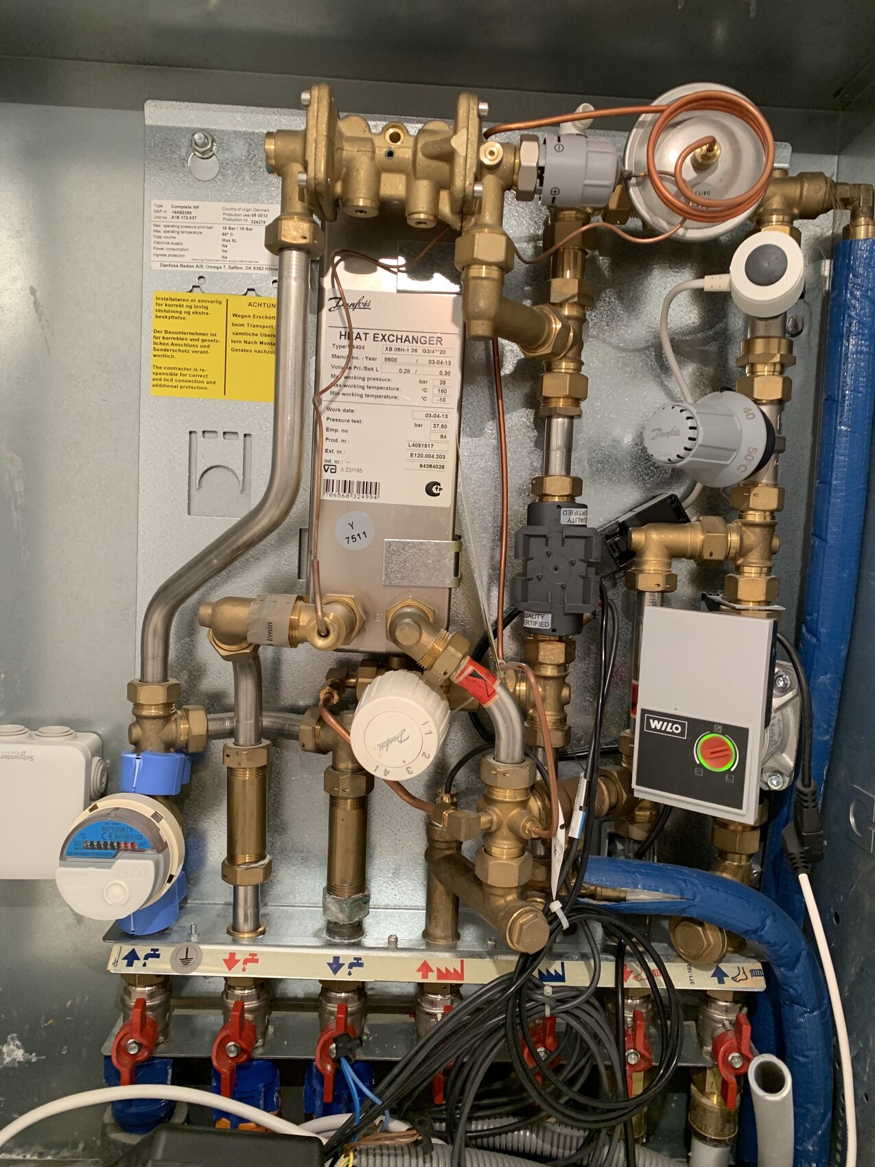 Compact heating and plumbing system with valves, WILO control unit and pump.