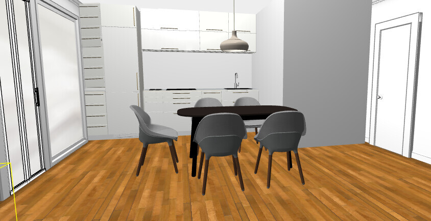 Dining area with dark table and gray chairs, kitchen in the background, wood floor.