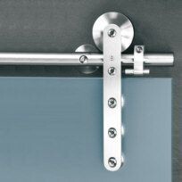 Close-up of a stainless steel door fitting with screws and roller bearing.
