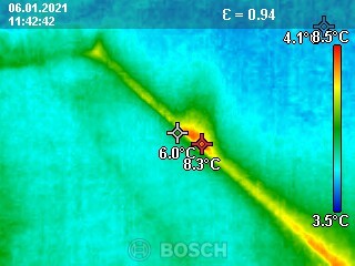Thermography image of a building services component showing heat distribution and cold areas.
