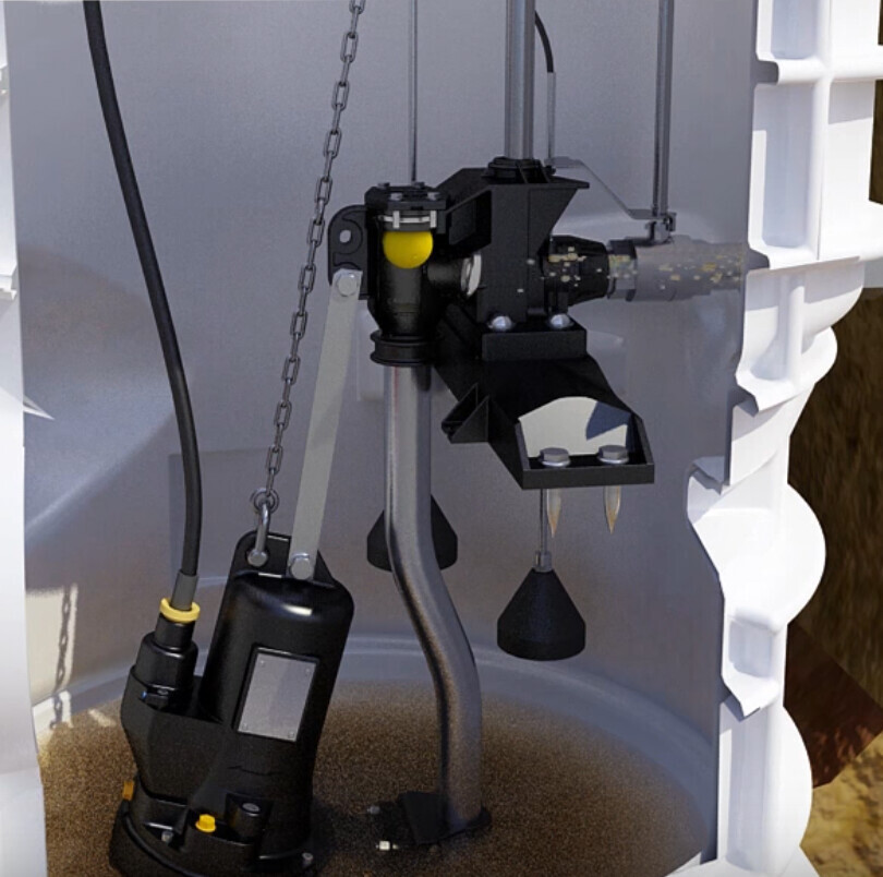 View inside a tank with mounting system: black device unit, yellow button, hoses, and chain.