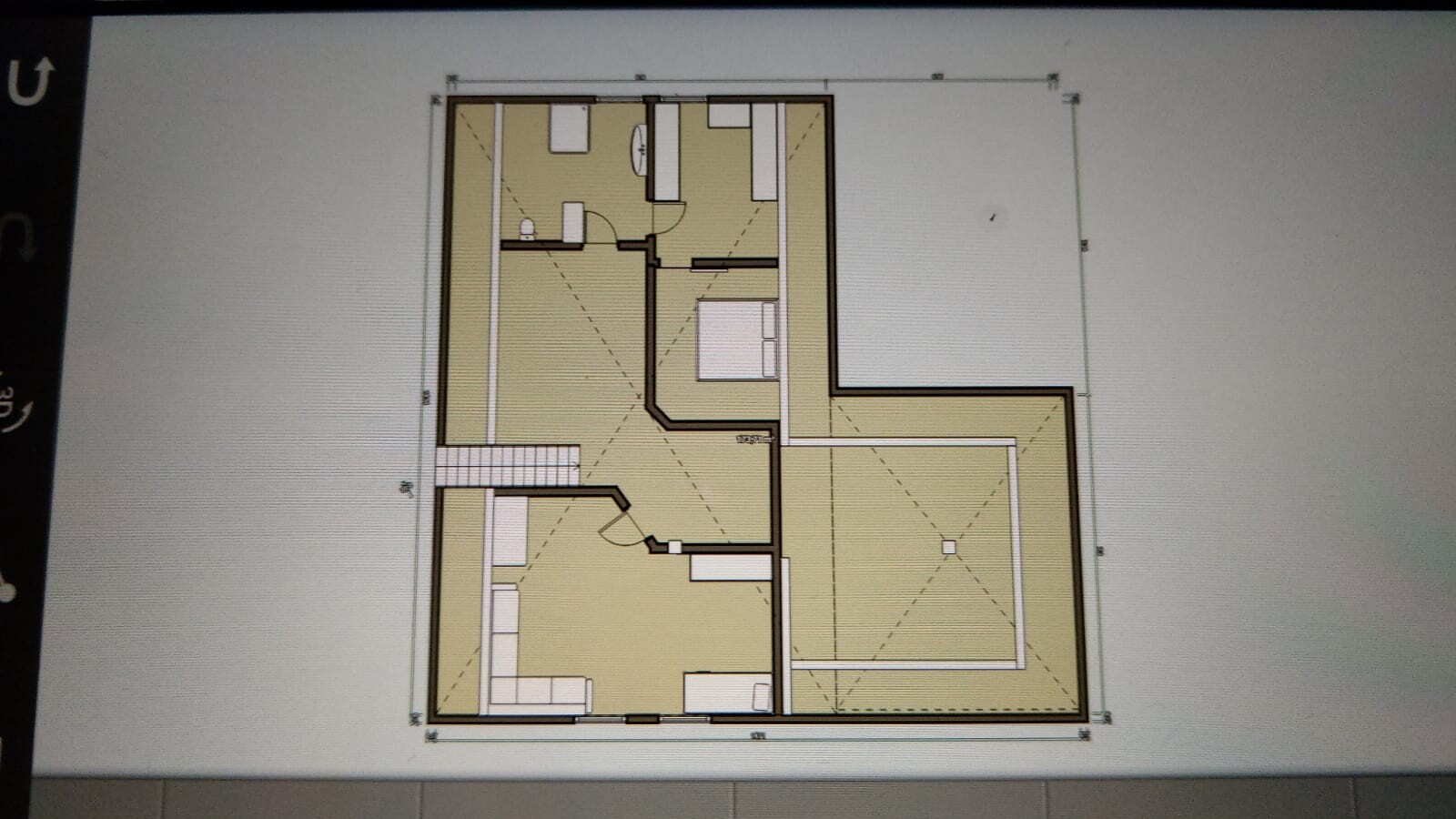 Floor plan of a residential house with several rooms, doors, stairs, and furniture.