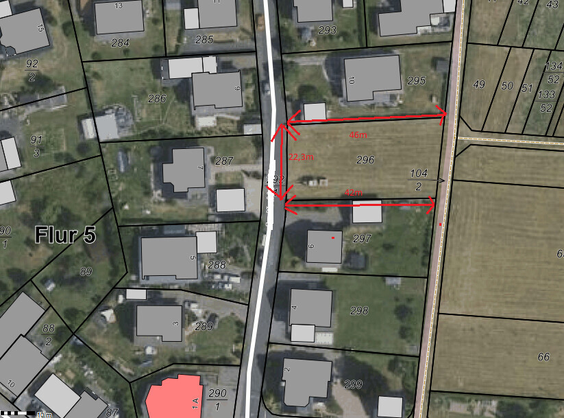 Site plan of a residential plot No. 296 with red measurement lines (46 m, 22.3 m, 42 m) along a street.