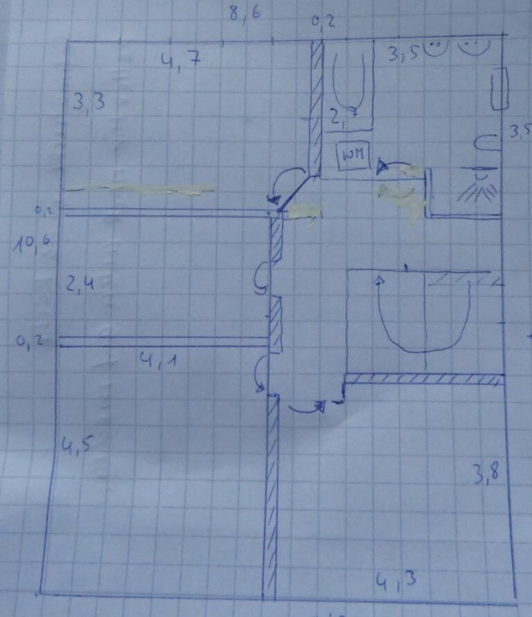 Hand sketch of a house floor plan showing room layout and measurements on graph paper