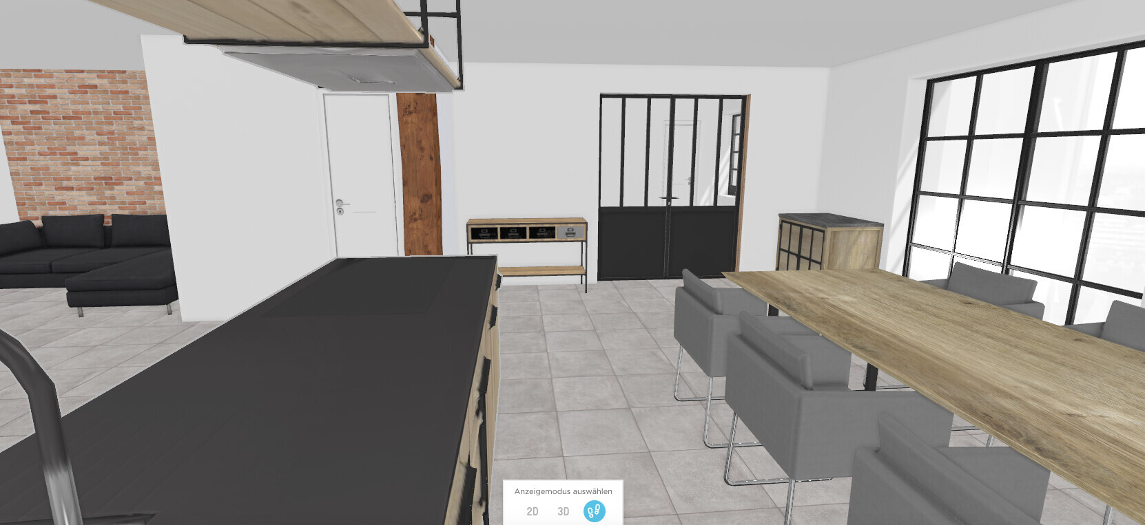 Open plan kitchen and living area with large wooden table and gray upholstered chairs, glass doors, and brick wall.
