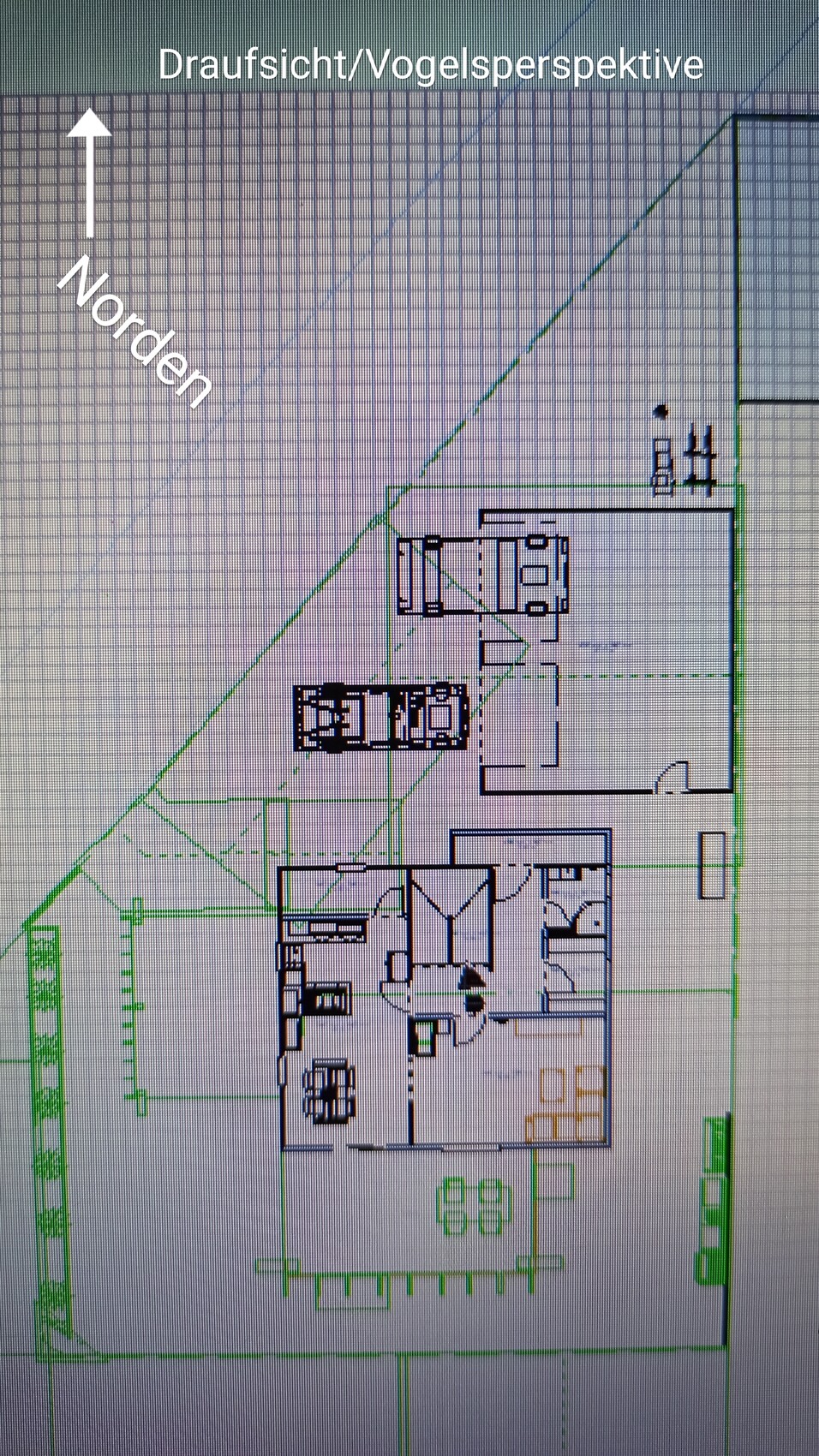 Top view/bird’s-eye view of a building site plan with building structure, vehicles and parking spaces.