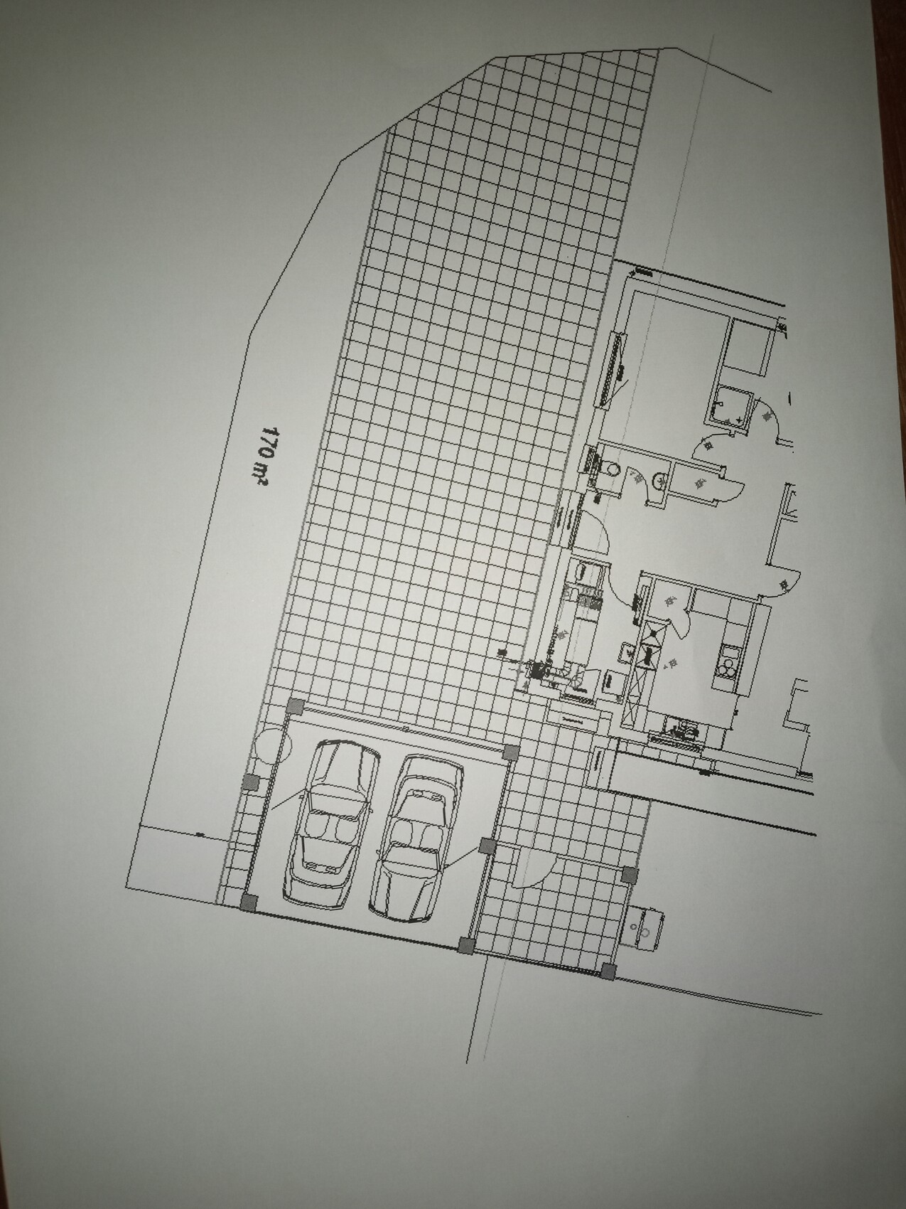 Floor plan of a house with garage for two cars and adjacent living area