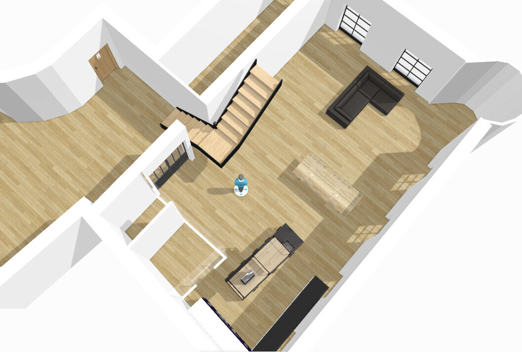 Top view: Open living area with sofa, dining table, kitchen island, staircase, and wooden floor.
