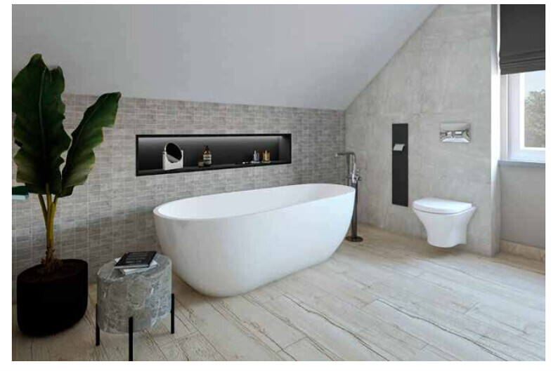 Modern bathroom: freestanding white bathtub, wall niche, toilet, and plant.