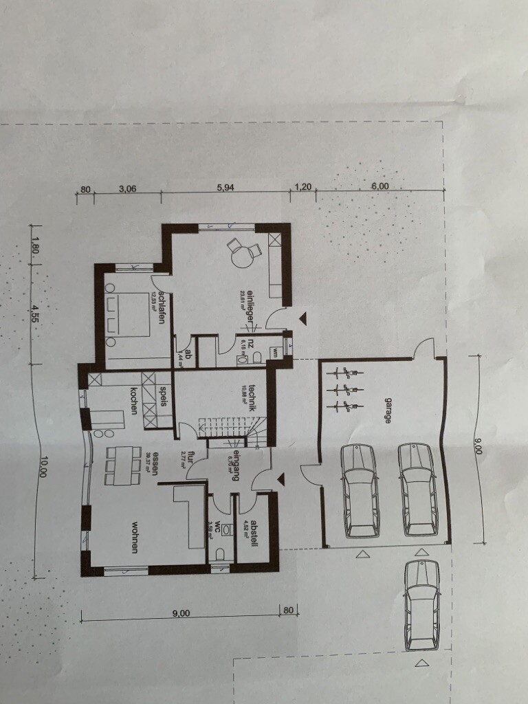 Floor plan of a house with living room, kitchen, dining area, bedroom, bathroom, storage room and garage.