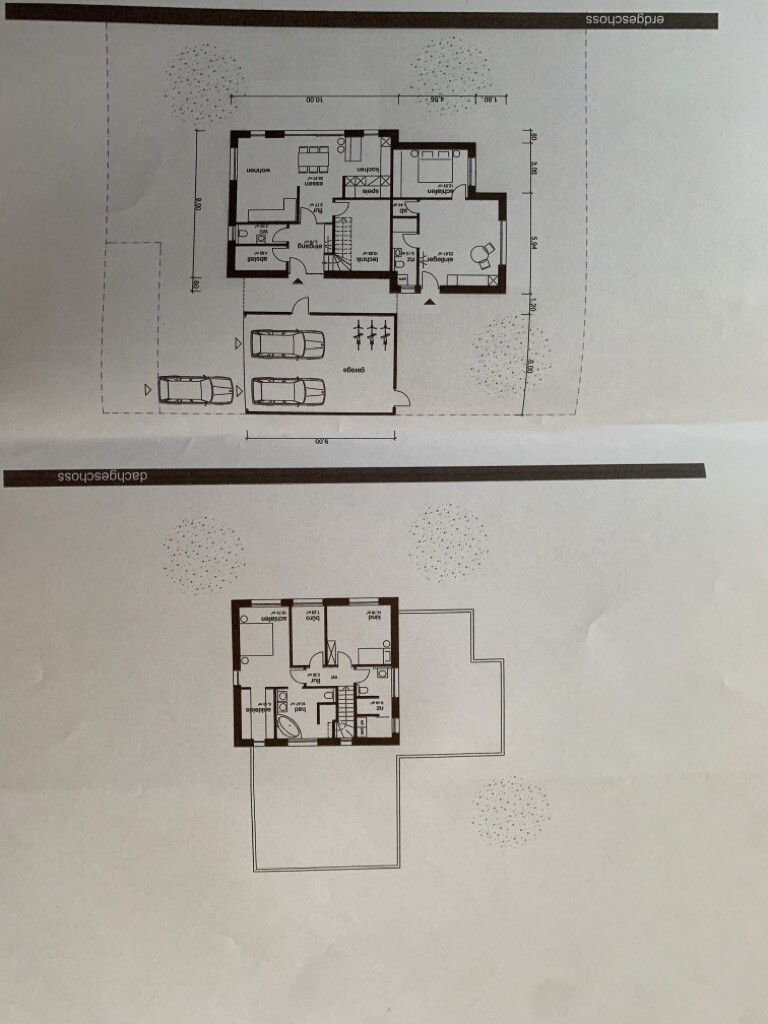 Two-storey house floor plan: ground floor with garage, kitchen, living room; upper floor with bedrooms.