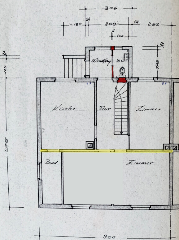 Floor plan of a house with kitchen, hallway, two rooms, bathroom, toilet, and staircase.