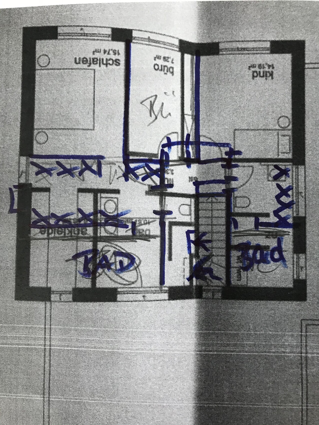 Apartment floor plan with blue marker lines and notes, e.g. ‘bathroom’.