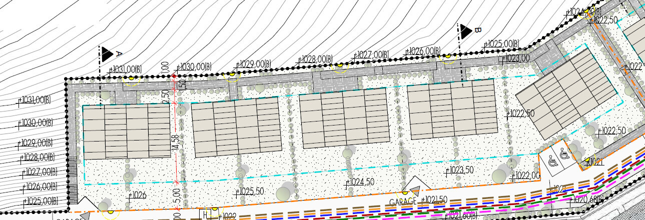 Site plan of a building plot: lots, parking spaces, garages, roads, trees.