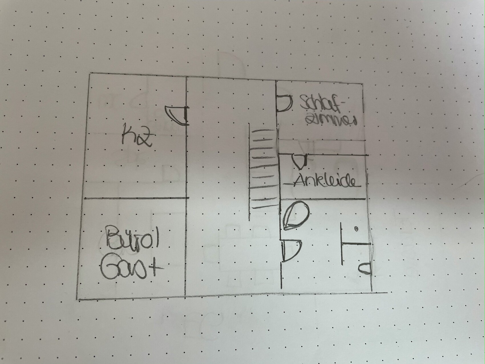 Hand-drawn floor plan: central staircase, bedroom with walk-in closet on the right, room on the left