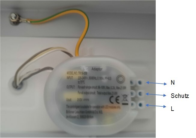 Round power adapter with three terminal screws (N, L, protective earth) and yellow-green grounding wire.