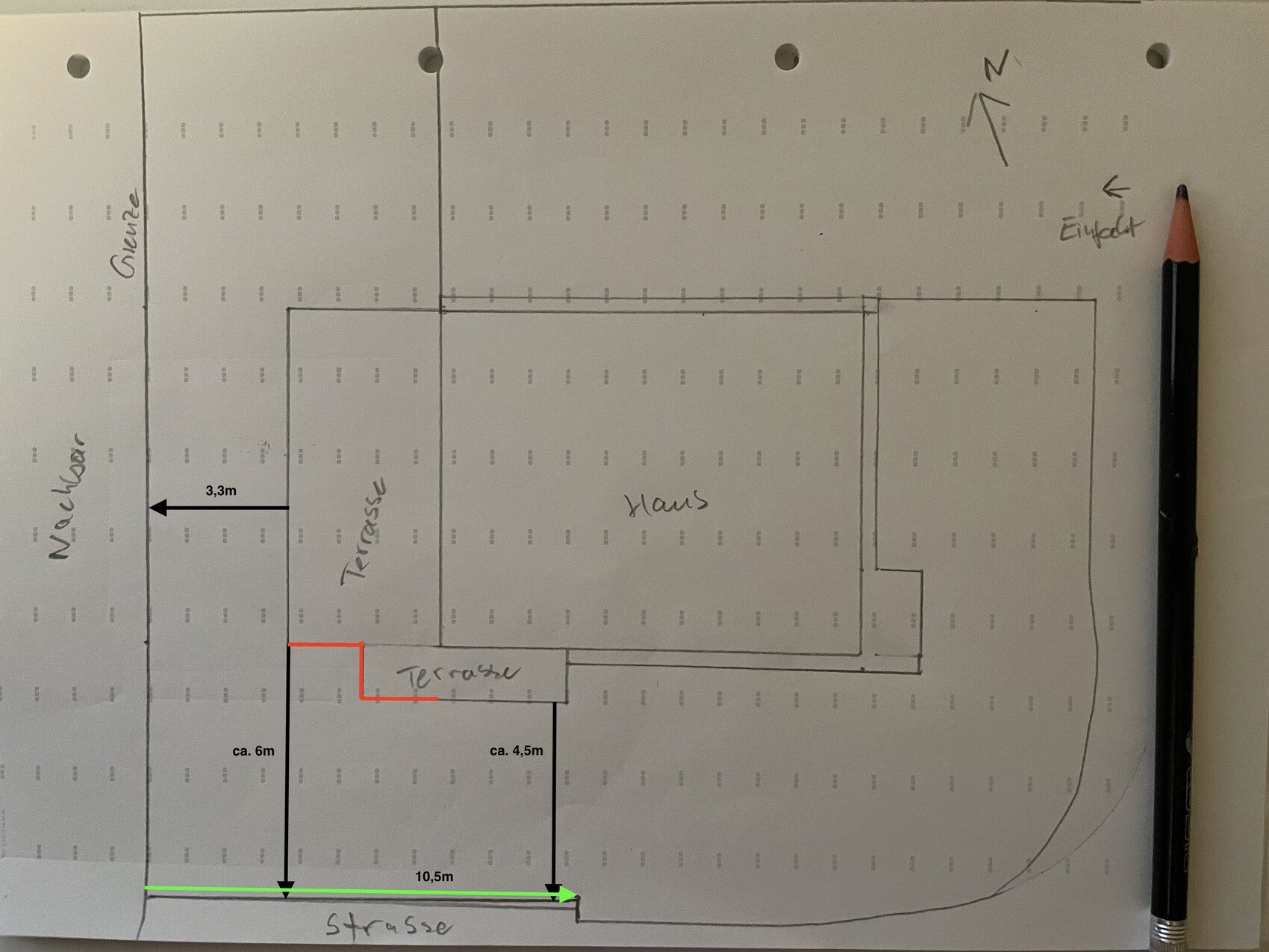 Hand-drawn property sketch: house with surrounding terrace, garden on the left, street at the bottom.