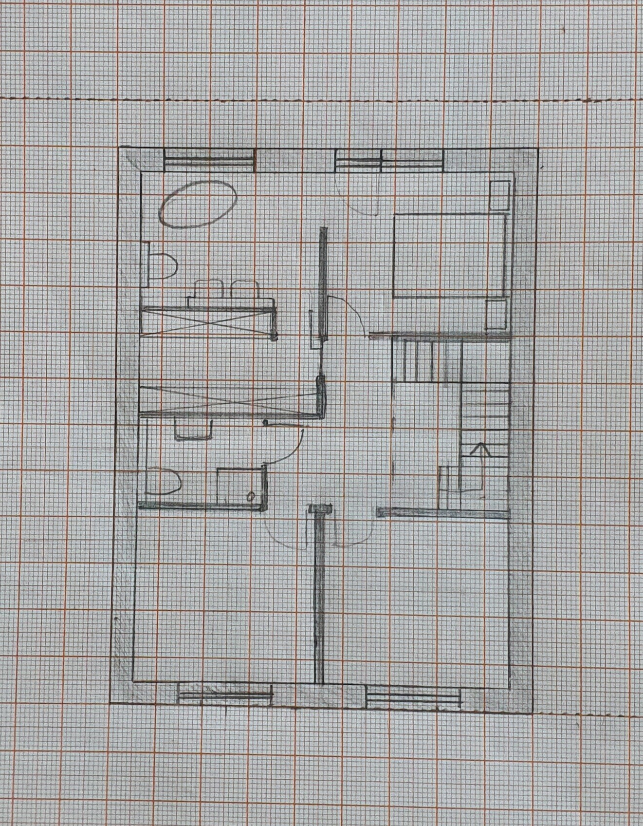 Sketchy floor plan of a house on millimeter paper with interior walls.