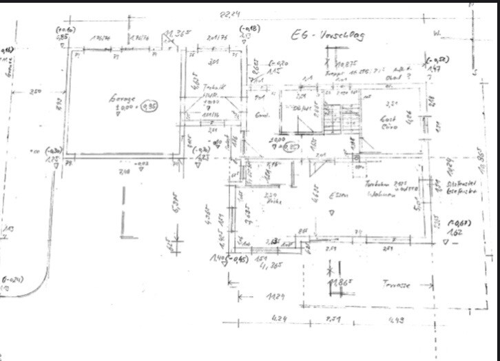 Floor plan of a building with rooms, doors, stairs and dimensions.