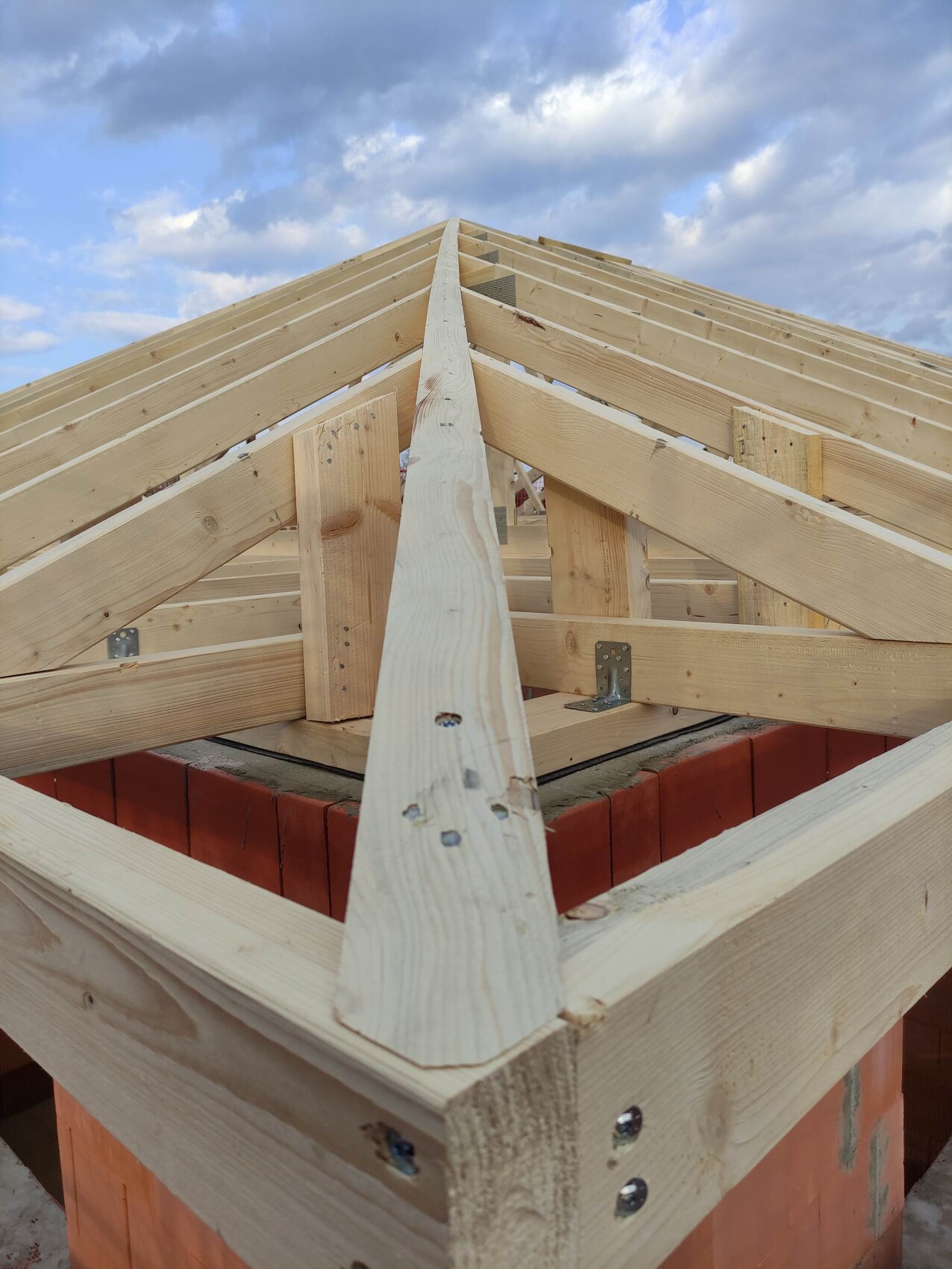 Wood roof structure with roof frame on construction site, beam structure in shell construction