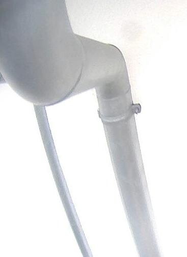 Close-up of a gray metal pipe with a connection in building services