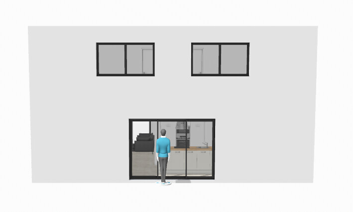 Person in blue in front of glass door, view into interior with kitchen; two windows on top of gray house visible.