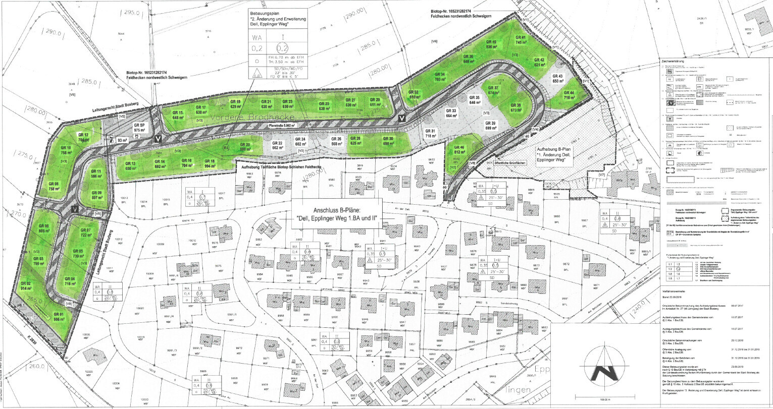 Plot and development plan with green building areas along a winding road.
