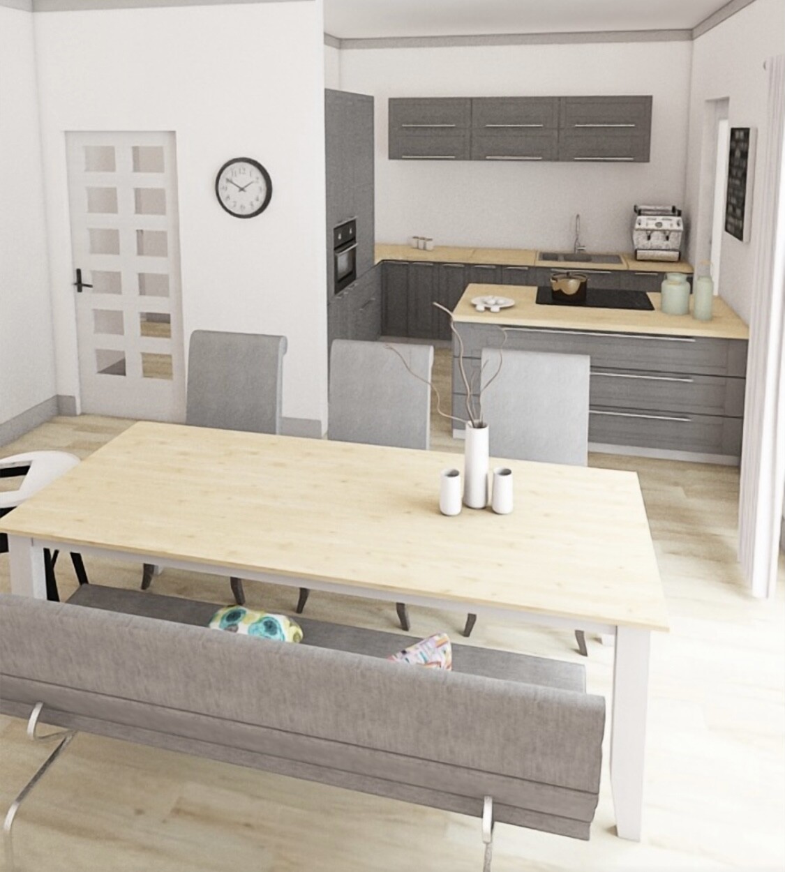 Modern kitchen with gray upper cabinets, island with cooktop, dining table and bench in foreground