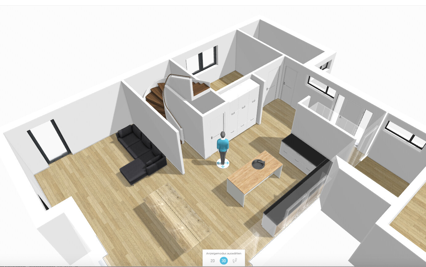 3D floor plan of an open living and kitchen area with staircase, sofa, and island