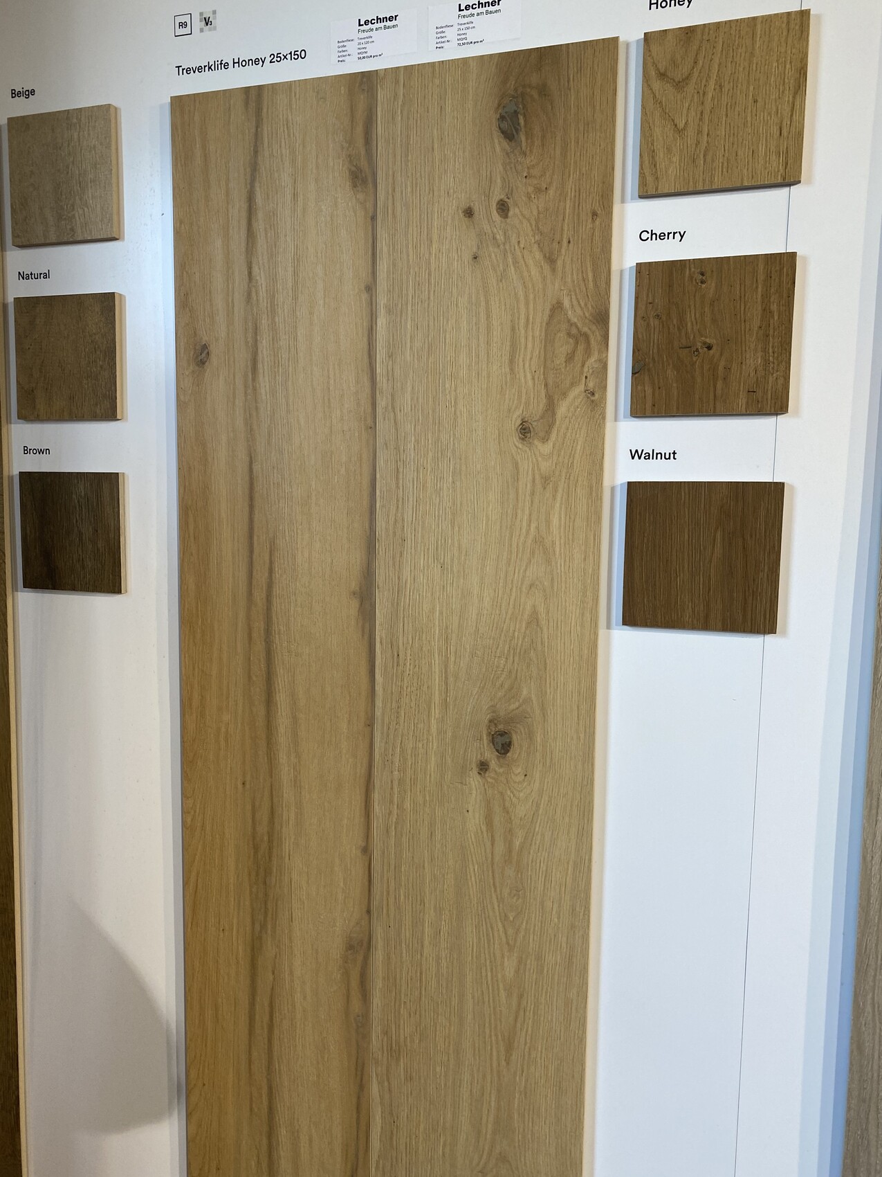 Large wood panel with grain, left beige/natural/brown, right cherry/walnut.