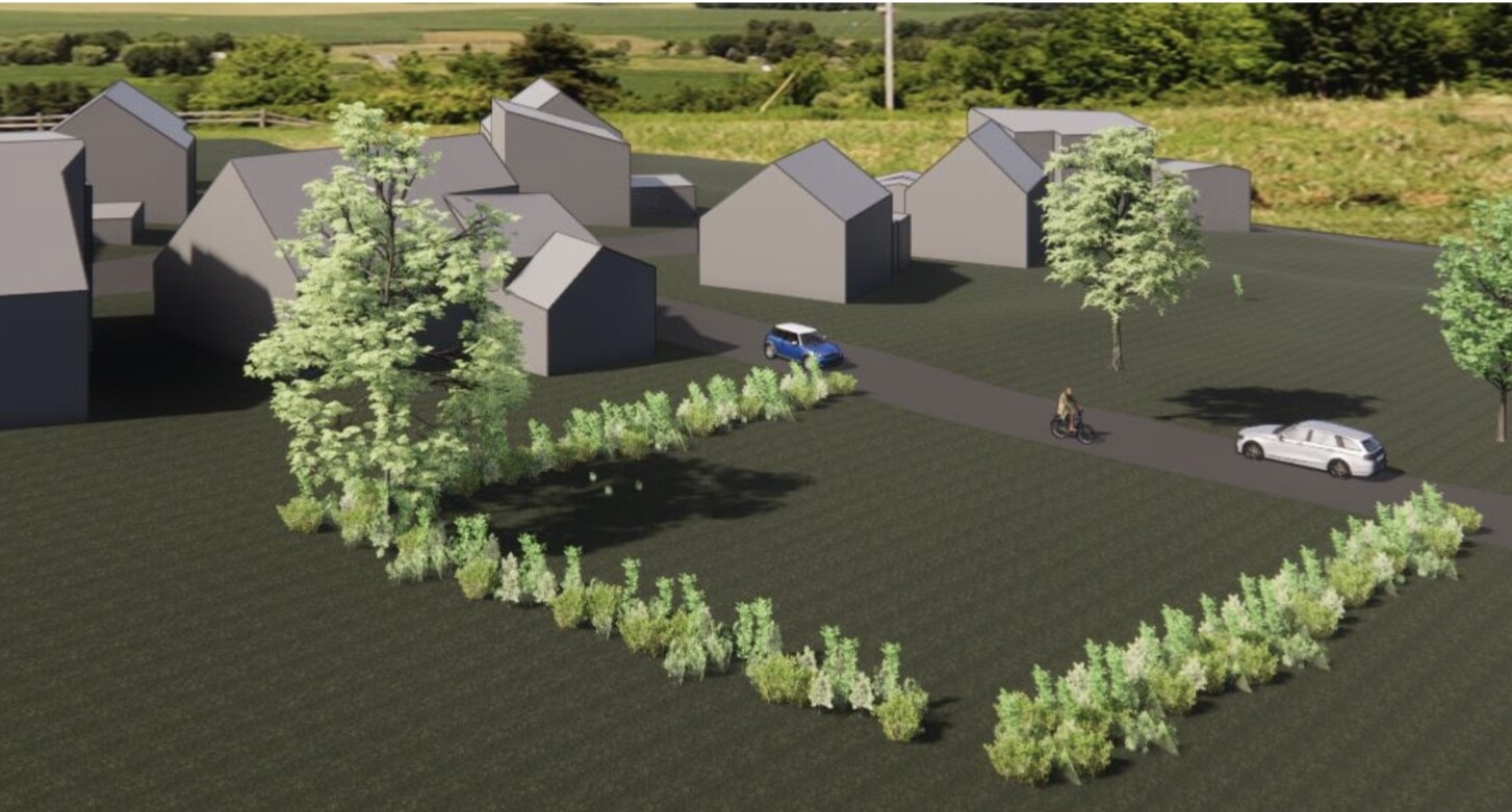 Residential area with grey houses, circular hedge border, car and cyclist