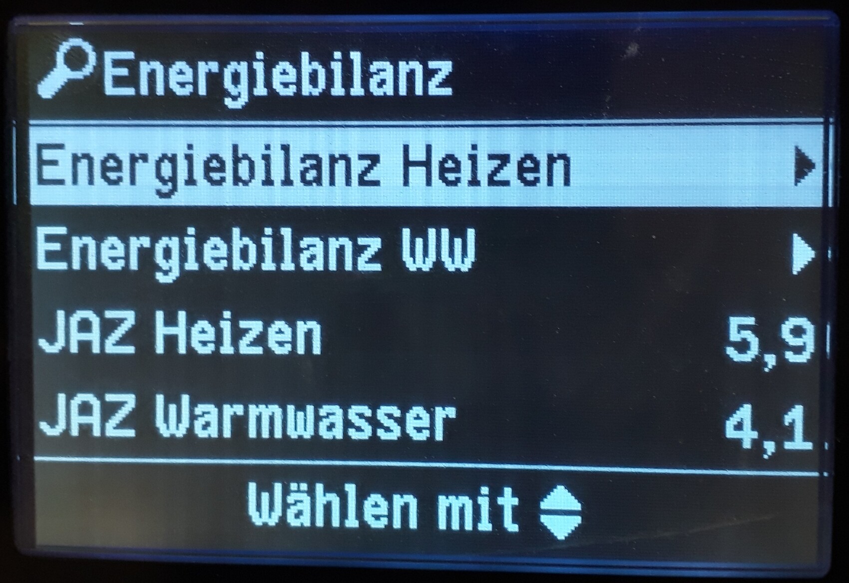 Display showing energy balance menu: heating, domestic hot water; COP heating 5.9, COP domestic hot water 4.1.
