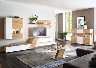 Modern living room with light wood furniture, wall-mounted cabinet, coffee table, and sofa.