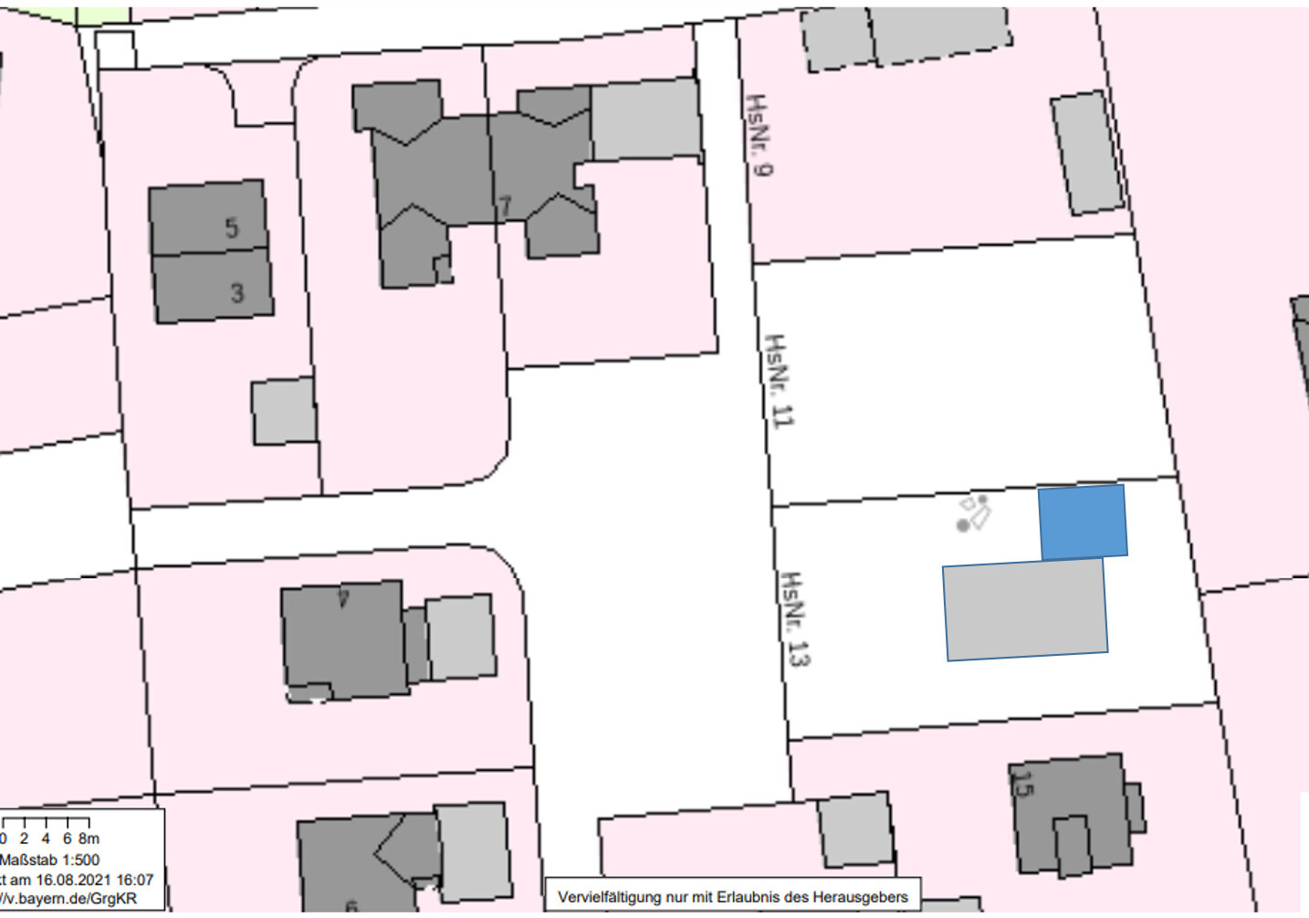 Site plan of a residential area with plots, grey buildings and one blue property.