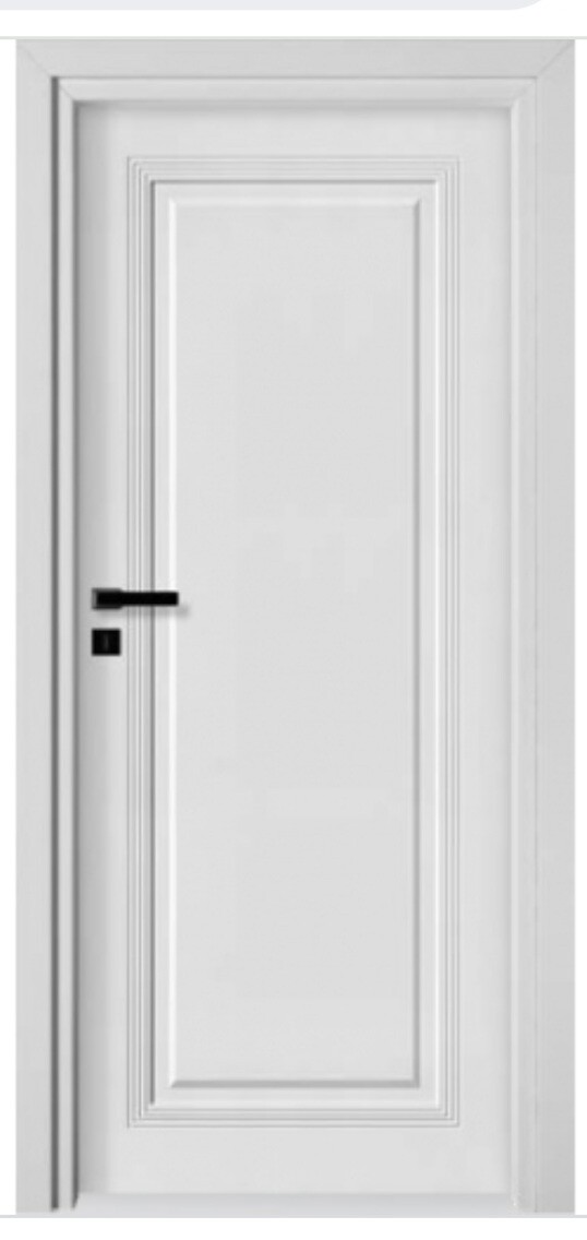 White door with decorative moldings and black door handle.