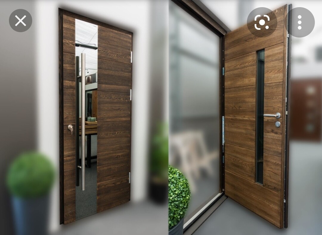 Two wooden doors in an interior showroom; one door with a mirror panel, the other open