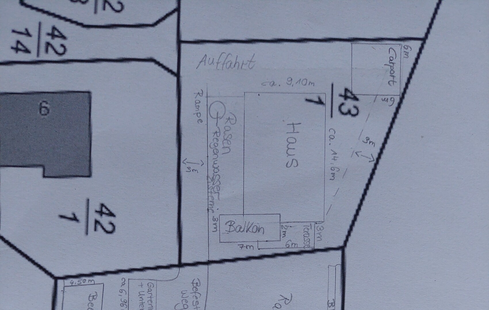 Floor plan of a house with balcony, driveway, terrace, and garden area on the plot