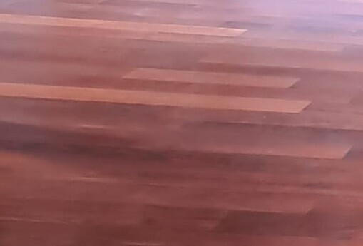 Wood floor with brown wooden planks, slightly blurry.