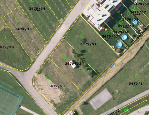 Aerial view of a building plot map with yellow boundary lines and plot numbers