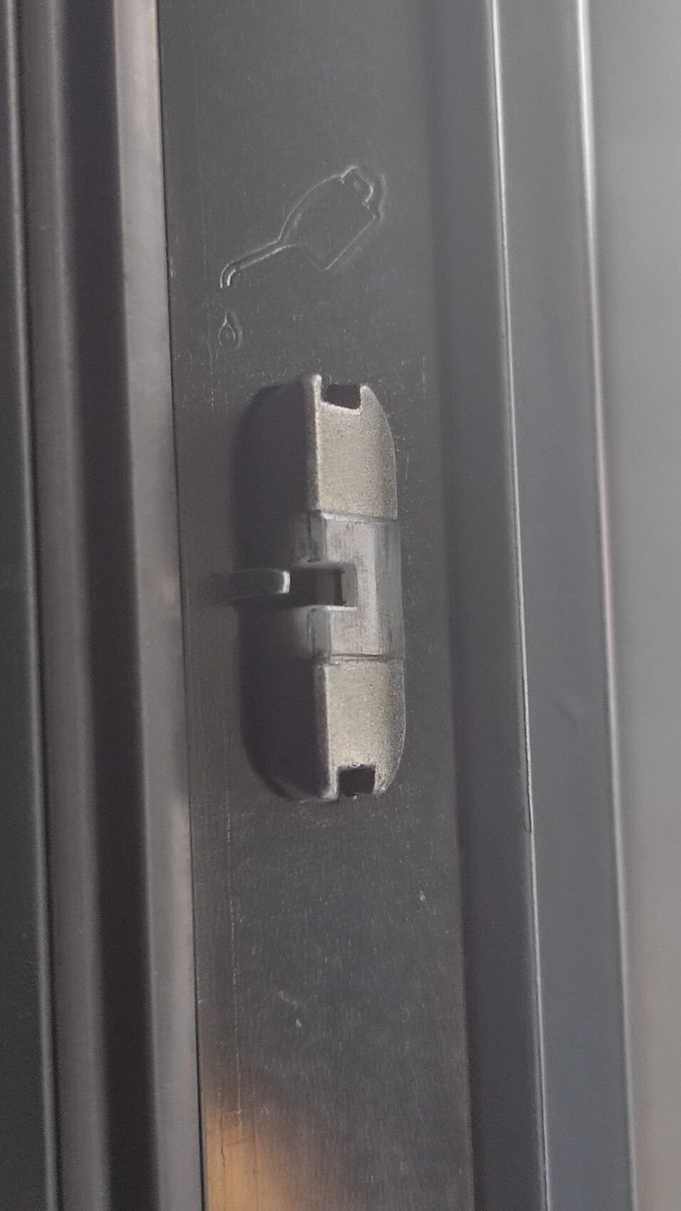 Close-up of a metal fitting in the window frame